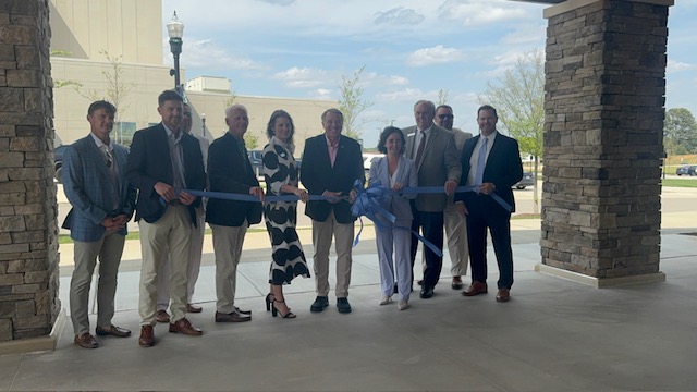 Community leaders cutting ribbon